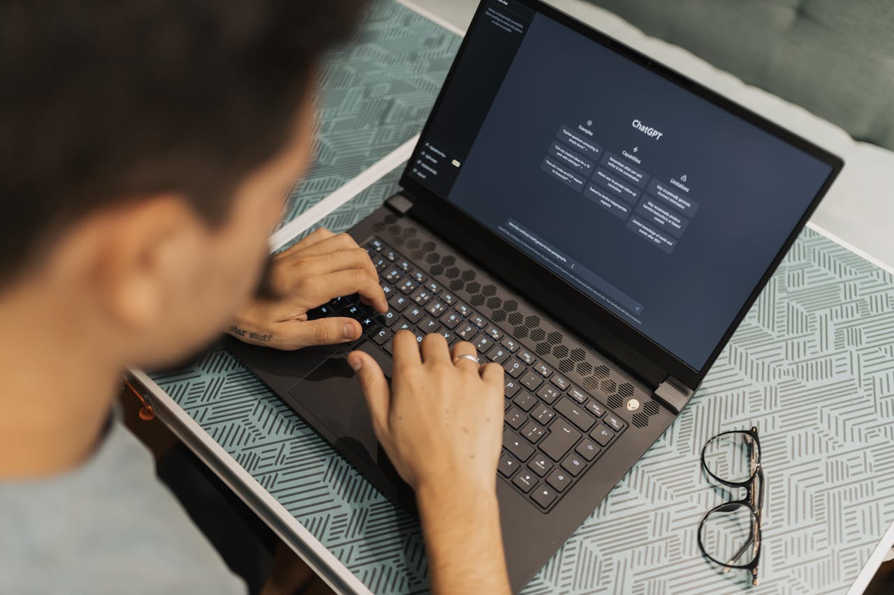 Man opening ChatGPT on a laptop